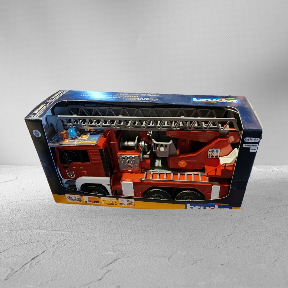 NIB Bruder 02771 MAN Fire Engine w/ Water Pump and Light & Sound Module